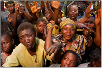 Congolese beneficiaries await the distribution of disease tolerant cassava seed from GLCI.