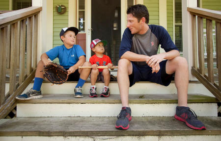 Camden and Jackson Charron,  age 9 and 4, sit on the front steps and talk baseball with Portland Sea Dogs pitcher Michael McCarthy, who lives with the Charron Family in their Falmouth home while the Red Sox AA team is in Portland.