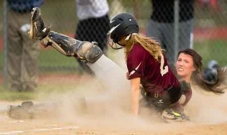 Windham catcher Sadie Nelson is on the ground after tagging Thornton Academy baserunner Taylor Paquette during fifth inning action.