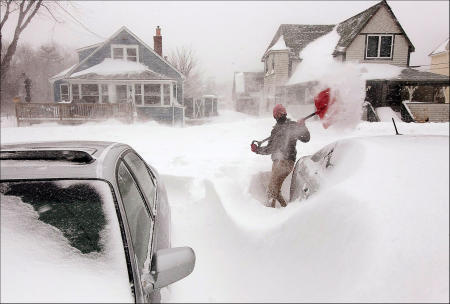 An Ocean Park resident digs out during a blizzard.