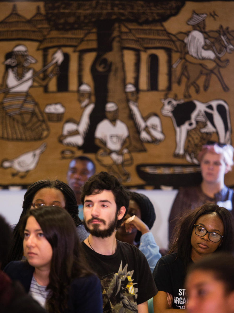 Colby College Alumni of Color Network members listen during a Homecoming Weekend meeting on the Waterville, Maine campus. (Shot for Colby College)