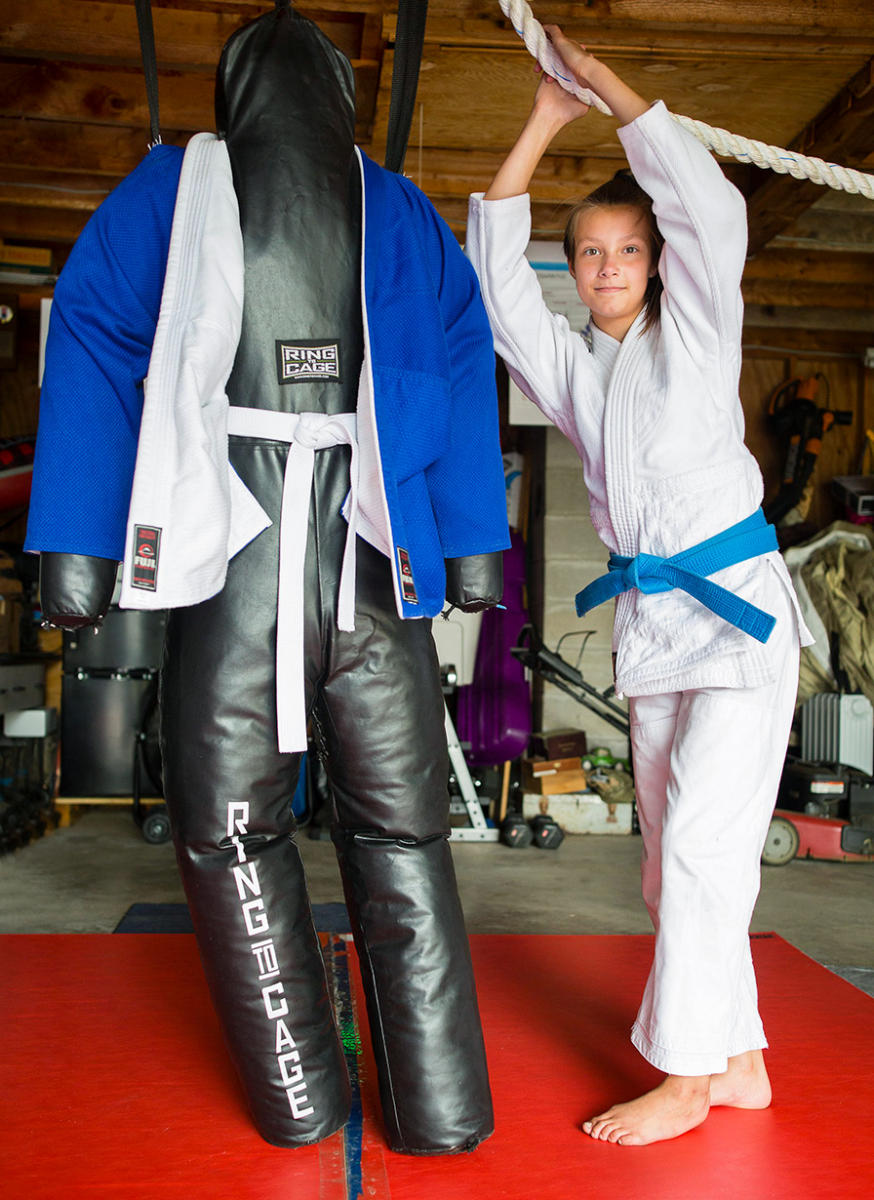12-year-old Kaci-Lee Ver Slui, a top judo competitor in the country, stands near her throwing dummy, in her Sabattus garage, where she trains, for Portland Press Herald.