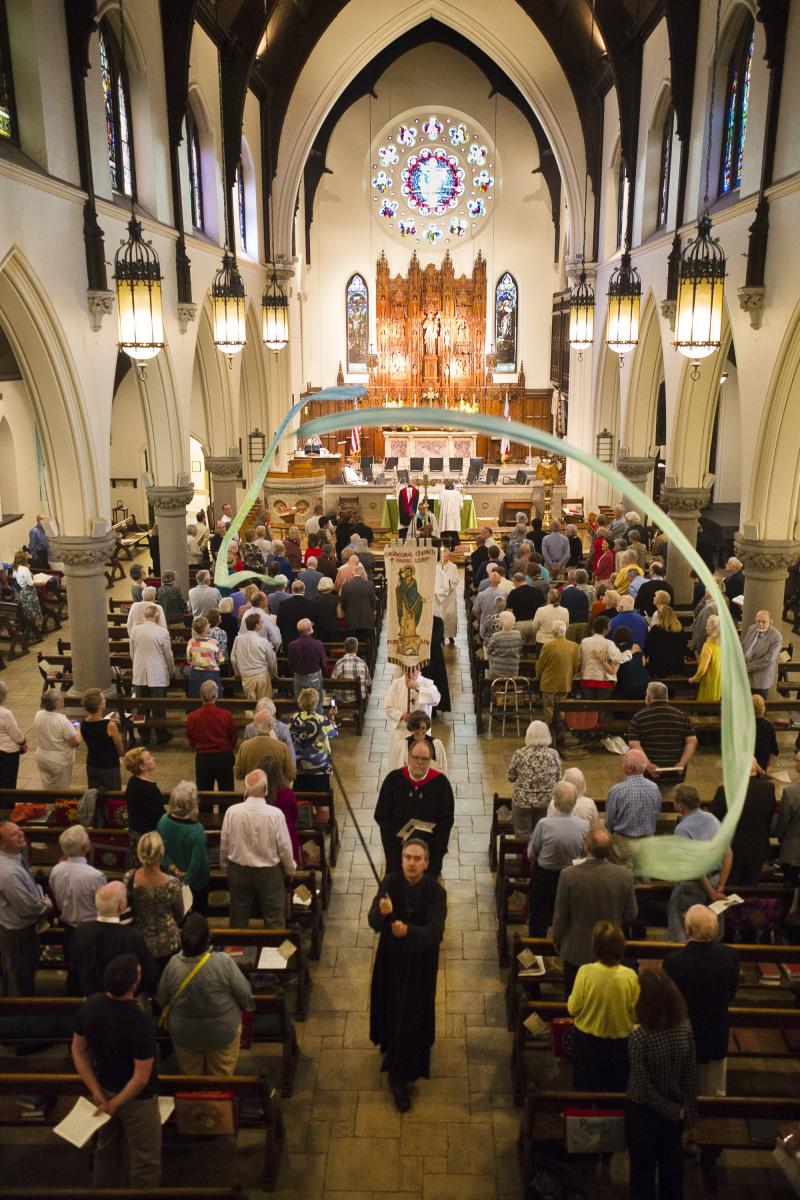 Members of St. Lukes (Episcopal) Cathedral recess after a ceremony to unveil the newly restored 14' rose window during a ceremony. Shot for The Portland Press Herald.  