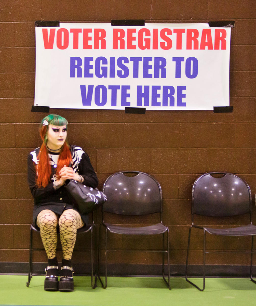 Destiny Anderson, 22 of Westbrook, waits to register to vote at the Fred C. Wescott Community Building on election day.