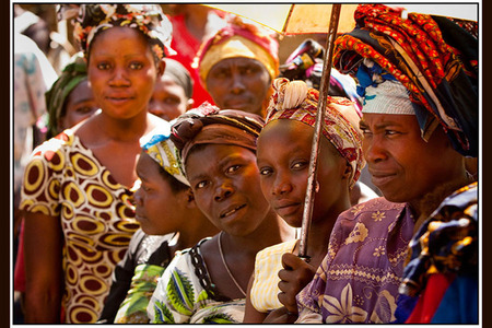 Congolese beneficiaries await the distribution of disease tolerant cassava seed from GLCI.