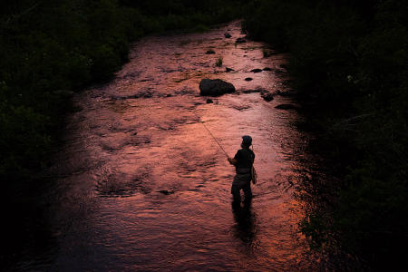 Larry Chambers of Antrim, NH  fly fishes in the Roach River, while staying at the Appalachian Mountain Clubs new lodge, Medawisla,  northeast of Greenville, Maine.