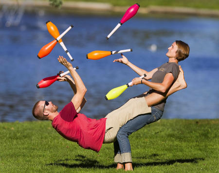 Bob and Trish Evans practice their tandem pin juggling routine in Deering Oaks Park in Portland.