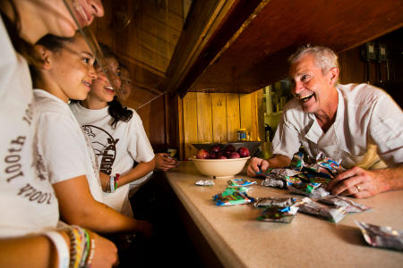 Chef Jonny St. Laurent chats with campers over the snack counter at Camp Walden in Denmark, Maine.