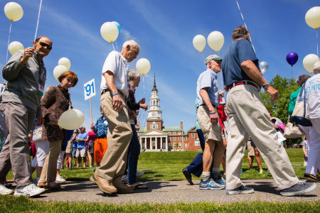 Colby College alumni march across the Waterville, Maine campus during a multi class reunion weekend. (Shot for Colby College)