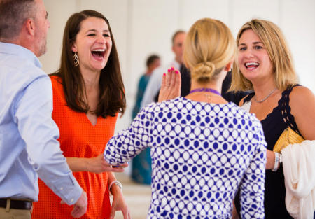 Colby College alumni get reacquainted during a Homecoming Weekend reception on the Waterville, Maine campus. (Shot for Colby College)