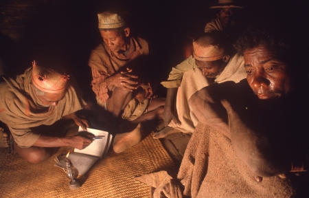 Namahoaka village elders notate offerings from mourning relatives during a funeral in the remote Madagascar village.