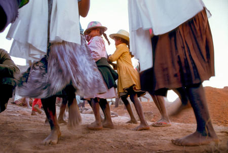 Betsileo villagers dance during a Famadihana ritual, which includes exhumation and rewrapping of remains in fresh shrouds. Some Malagasy worship the ancestors, believing all will be well in their lives if they honor and remember the ancestors.