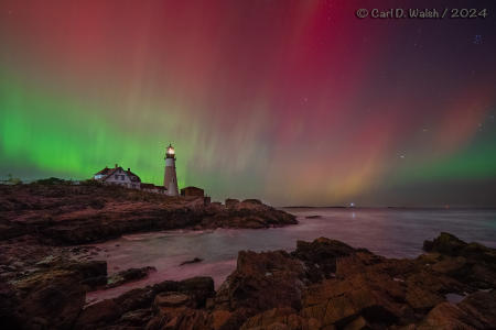 Unusually extreme Northern Lights, this far south, over Portland Head Light on the Maine Coast on October 10, 2024