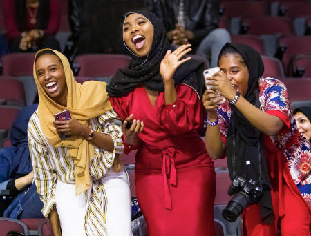 Sisters Hamdi Sheikh, Fardowsa Mohamed and Aisha Mukhtar cheer for their sister Maryan Mukhtar who had just received a degree in Liberal Studies during the Southern Maine Community College commencement.